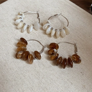 Minimalist resin hoop earrings with pearlescent and amber beads on silver rings