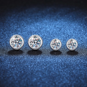 Classic 925 sterling silver moissanite stud earrings in two different sizes on blue background