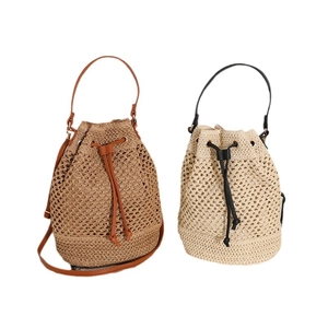 Hollow straw woven bucket bag in dark brown and off-white with PU leather straps