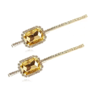 Elegant gold-tone hair clips with large yellow emerald-cut crystals and white rhinestones