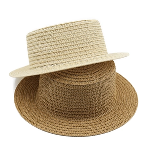 Flat top straw boater hats in beige and dark brown with woven paper straw texture
