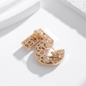 Elegant gold number 5 brooch with hollowed zircons on white geometric steps