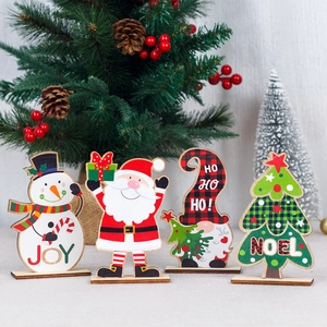 Handcrafted wooden Christmas tabletop ornaments featuring Santa, Snowman, and Noel designs