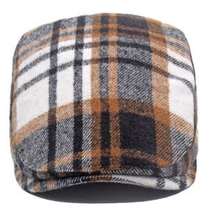 Close-up of thick brown plaid wool fabric and texture on the winter newsboy cap