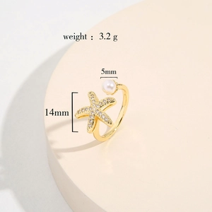 Detail showing 14mm starfish motif and 5mm pearl on 18K gold plated adjustable ring