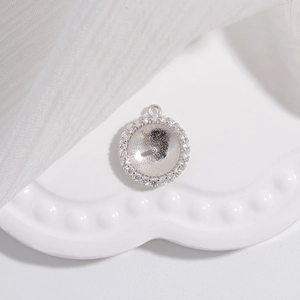 Macro shot of S925 sterling silver sunflower pearl stud setting with cubic zirconia