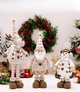 Detailed trio of plush Christmas figurines including reindeer, Santa, and snowman in knit fabric