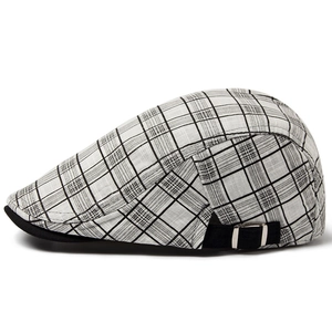 Men's summer plaid beret hat with adjustable buckle and black brim in a side profile view