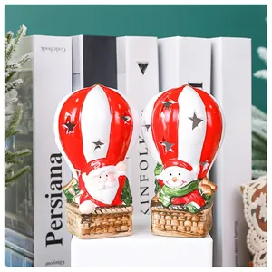 Detailed view of hollow star hot air balloon Christmas ornaments with Santa and Snowman