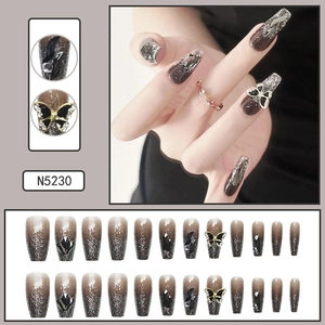 Close-up of luxury French style press-on nails with 3D butterfly and glitter detail
