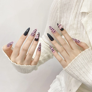 Pink and black zebra pattern handmade press-on nails with 3D bow and heart decorations