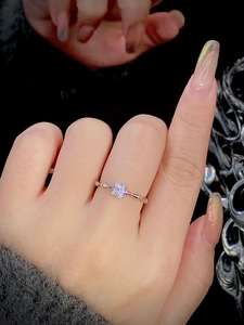 Detail of silver S925 ring featuring a bamboo texture band and round sparkling stone
