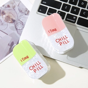 Glitter PVC capsule hair clips in pink and green with Chill Pill 15mg text design