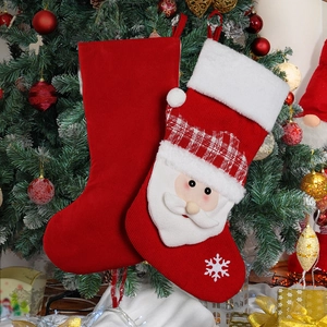 Creative Christmas socks decorations featuring velvet and knit styles hanging on a festive tree