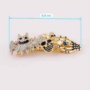 Detail of 8.8cm Halloween hair clip featuring rhinestone bat and golden skeleton design