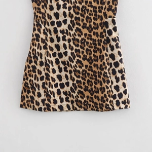 Women's summer leopard print A-line mini dress with textured fabric and fine stitching