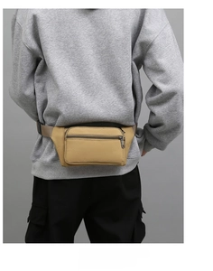 Rear view of khaki nylon waist bag with durable straps and plastic buckle for outdoor work