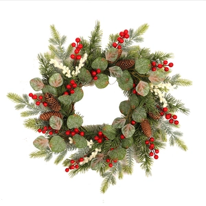 Christmas wreath with red berries, eucalyptus leaves and natural pine cones for home decor