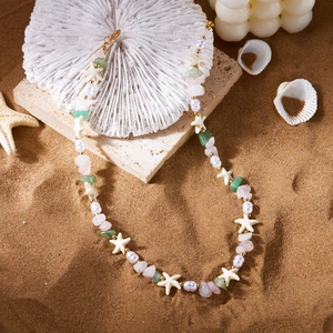 Detailed close-up of bohemian beaded necklace with starfish and colorful natural stones