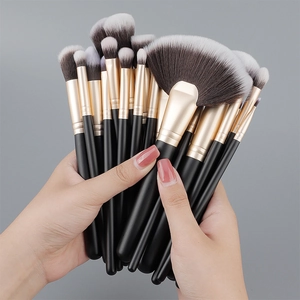 Detail of professional 24pcs black and gold makeup brushes with soft synthetic bristles