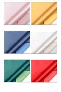 Detail view of double-sided pearlescent gift wrapping paper in six vibrant colors