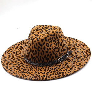 Close-up of leopard print fedora hat featuring a black braided leather band and metal buckle