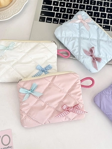 Quilted bow makeup bags in macaron colors with portable handle and zipper closure