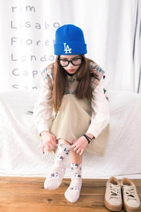 Detail of cotton crew socks featuring a cute cartoon cat pattern and LOVE ME lettering