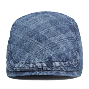 Vintage washed denim newsboy cap with quilted diamond pattern and classic blue gradient