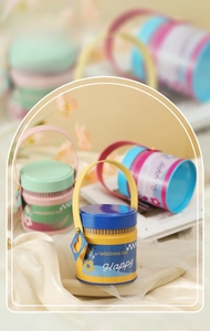 Detail of colorful metal candy gift box with PU leather handle for wedding celebrations