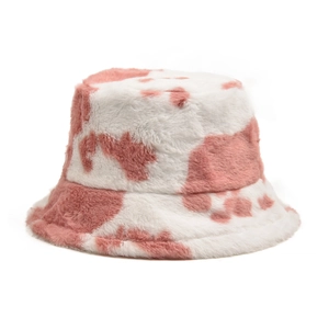 Detailed close-up of soft pink cow print faux fur plush texture on a warm bucket hat