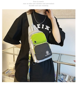 Water-resistant crossbody chest bag with grey and neon green color-block design and ropes