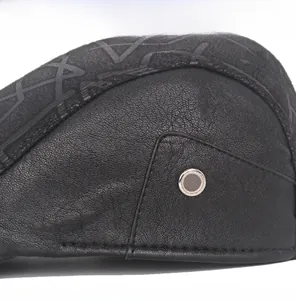 Detail of leather ivy cap featuring metal ventilation hole and star pattern print