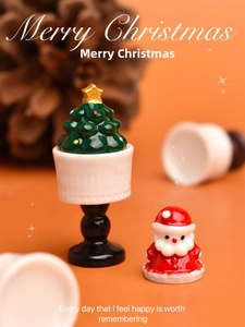 Miniature Christmas resin figurine set featuring Santa Claus and a small Xmas tree decor