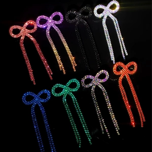 Bowknot long tassel earrings with shiny rhinestones in eight vibrant colors on black