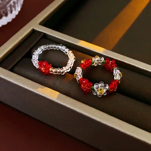 Colorful beaded flower rings set with transparent and red floral resin jewelry