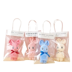 Coral fleece square hand towels folded in rabbit shapes with gift bags in four colors