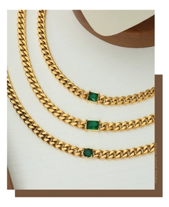 Detail of vintage gold-plated Cuban chain necklace featuring green zircon gemstones