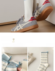 Detail of blue striped cotton socks with a stitched heart label and a ribbed texture
