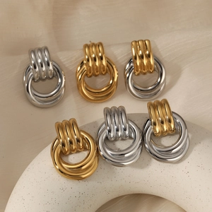 Retro multi-layered twisted hoop earrings in gold, silver, and dual-tone stainless steel