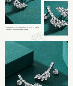 Detail view of S925 sterling silver leaf earrings with marquise-cut cubic zirconia stones