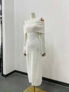 Detail of elegant off-shoulder fold-over neckline on white knitted slim midi dress