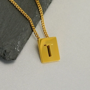 Minimalist golden stainless steel rectangle pendant necklace with hollow letter T design