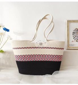 Close-up of woven tote bag showing contrast color cotton rope stitching and texture
