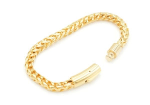 Close-up of golden wheat chain bracelet with a secure square box clasp mechanism