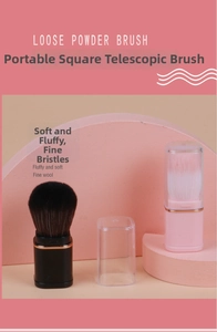 Detail showing the portable square retractable makeup brush with a clear protective cap