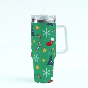 Close-up of green 40oz Christmas tumbler with handle and festive tree patterns