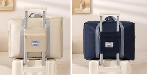 Detail of waterproof travel bag back pocket sleeve attached to a suitcase handle