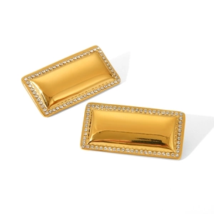 Macro shot of 18K gold plated rectangular earrings with sparkling white zircon crystals