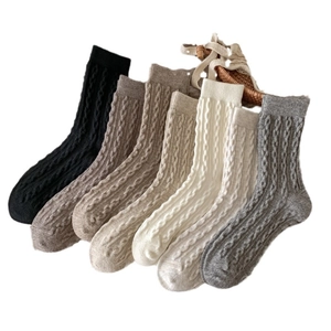 Set of seven women's cable knit crew socks in neutral earthy tones for autumn winter